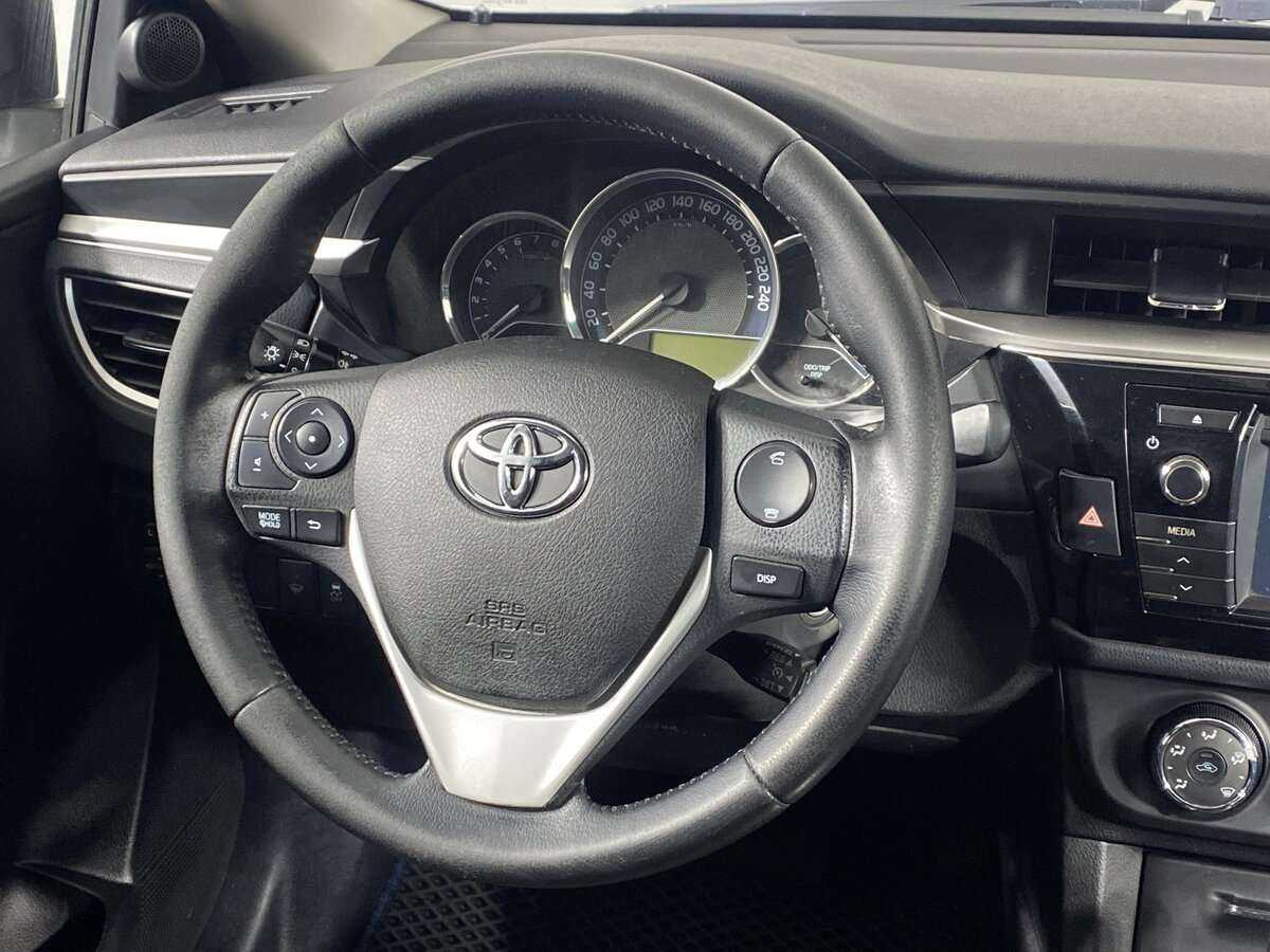 Toyota Corolla с пробегом — 2013 год. Фото: #11