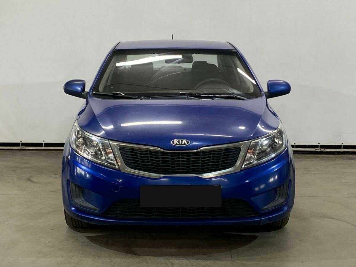 Kia Rio с пробегом — 2013 год. Фото: #1