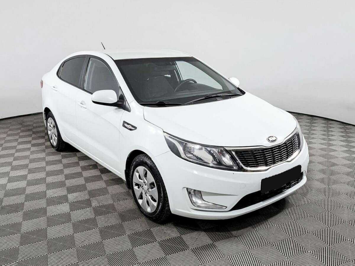 Kia Rio с пробегом — 2013 год. Фото: #2