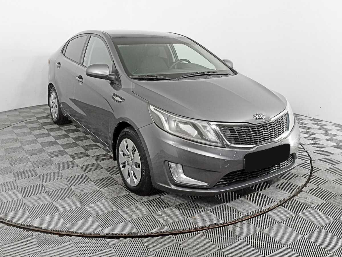 Kia Rio с пробегом — 2013 год. Фото: #1